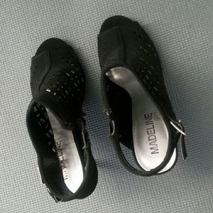 Trendy heeled booties with lattice design.